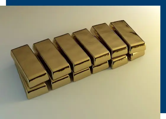 A row of gold bars sitting on top of a table.